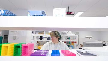 A worker is pictured at the Scientia Clinical Research Ltd lab in Randwick.