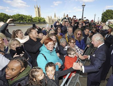 Britain's King Charles III meets members of the public in the queue along the South Bank, near to Lambeth Bridge, 