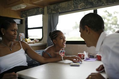 Michelle Obama, Malia Obama and Barack Obama