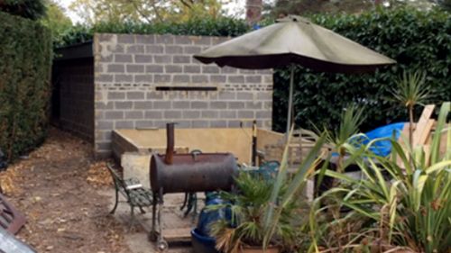 The stark concrete shed in a suburban English garden where the Polish man lived for four years.