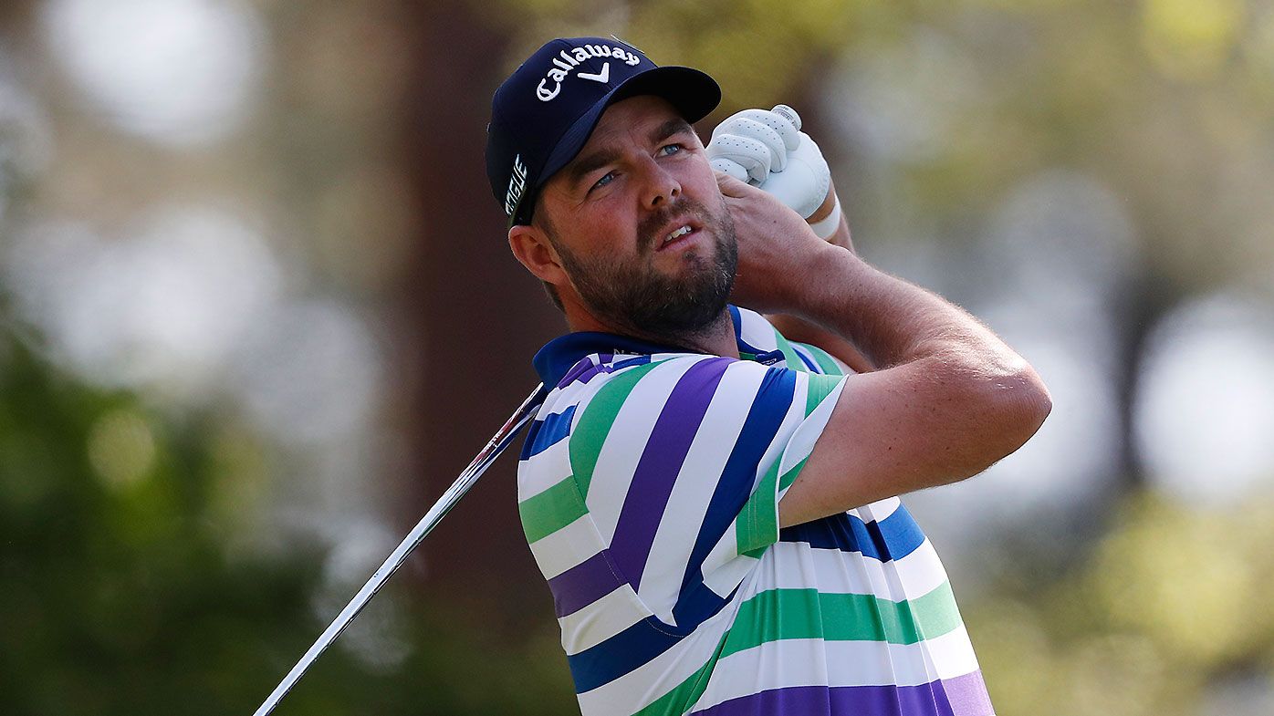 Marc Leishman of Australia hits his tee shot on the fourth hole