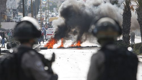 Israeli troops clash with Palestinians following protests against US President Donald Trump's decision to recognize Jerusalem as the capital of Israel. (AAP)