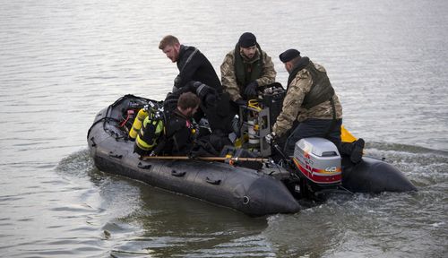 Royal Navy bomb disposal divers in King V George Dock close to London City Airport which has been closed, as they head out to move an unexploded Second World War bomb discovered in the dock.. (PO Phot Owen Cooban/Royal Navy/MoD/Crown copyright/PA Wire).