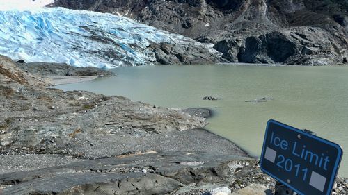 This May 9, 2020 file photo shows the Mendenhall Glacier in Juneau, Alaska. As glaciers melt and pour massive amounts of water into nearby lakes, 15 million people across the globe live under the threat of a sudden and deadly outburst flood, a new study finds.