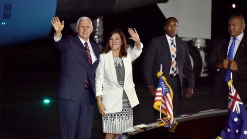 United States Vice President Mike Pence and his wife Karen wave as they arrive in Cairns, Australia.