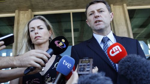 In this 2014 photo,  Kate and Gerry McCann talk to the media outside a court in Lisbon.
