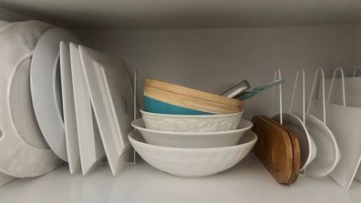 Kmart file racks used to organise platters in kitchen cupboards, storage hack