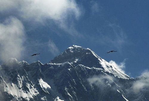 Birds glie in the Himalayas as Mount Everest is seen from Namche Bajar, Solukhumbu district, in Nepal.