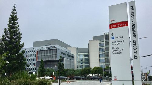 Gold Coast University Hospital, where a man is in a critical condition after allegedly being involved in a brawl that left another man dead in northern NSW.