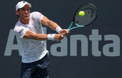 ATLANTA, GEORGIA - JULY 28:  Matthew Ebden of Australia returns a shot during the match against Jason Kubler of Australia and John Peers of Austraila at the Atlanta Open at Atlantic Station on July 28, 2022 in Atlanta, Georgia. (Photo by Kevin C. Cox/Getty Images)