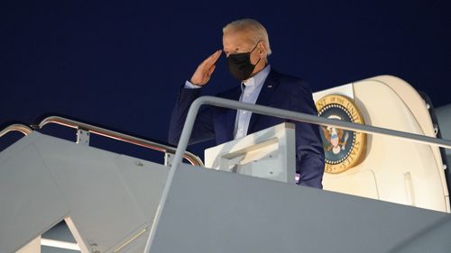 President Joe Biden salutes as he boards Air Force One for a trip to New York for the 9/11 commemorations.