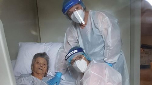 Mrs Manuele two daughters wearing PPE while visiting her during the coronavirus pandemic.