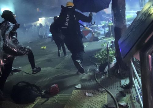 Police had fired repeated barrages of tear gas and water cannon at protesters outside the campus since before midnight.