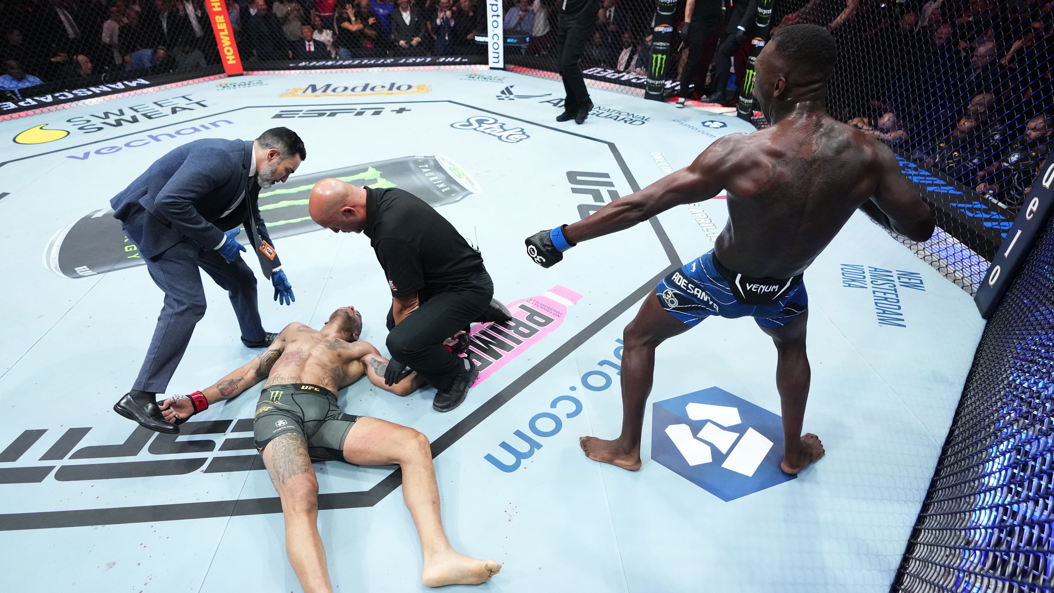 Israel Adesanya reacts after knocking out Alex Pereira in the UFC middleweight championship fight during the UFC 287 event.