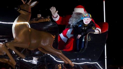 Thousands in Canadian town celebrate Christmas early for terminally ill boy