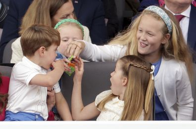 Prince Louis, Princess Charlotte, Savannah Phillips and Mia Tindall eat sweets during the Platinum Jubilee Pageant.