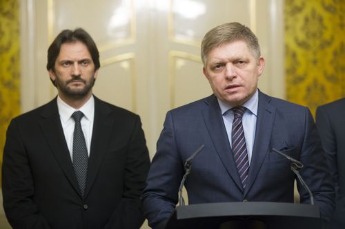 Slovak Prime Minister Robert Fico, right, gives a media statement, with Minister of Interior Robert Kalinak, left, after a silent protest march in memory of murdered journalist Jan Kuciak and his girlfriend Martina Kusnirova in Bratislava, Slovakia on Wednesday, Feb. 28, 2018. Investigative journalist Kuciak was shot dead in Slovakia last week while working on a story about the activities of Italian mafia in Slovakia and their alleged links to people close to Prime Minister Robert Fico.(AP Photo/Bundas Engler)