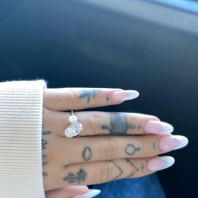 Ariana Grande flashed her giant engagement ring in December last year.