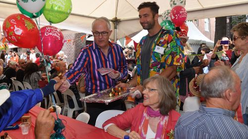 Malcolm Turnbull feeding those at Sydney's Wayside Chapel this morning. (Image: AAP)