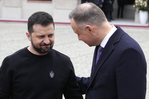 Poland's President Andrzej Duda, right, welcomes Ukrainian President Volodymyr Zelenskyy as they meet at the Presidential Palace in Warsaw, Poland, Wednesday, April 5, 2023. 