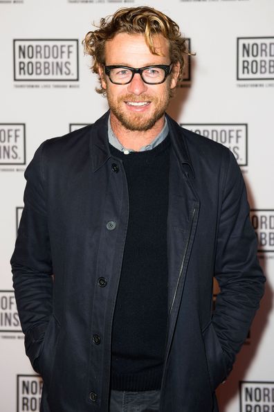 Simon Baker debuts relationship with designer Laura May Gibbs.