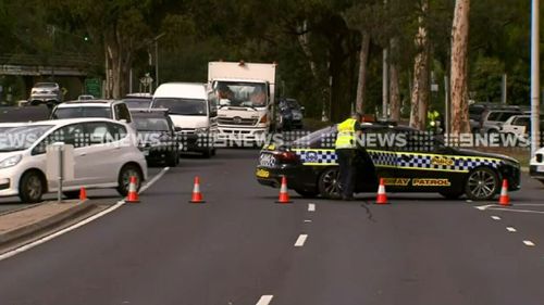 Motorcyclist has died in a crash involving a black Mercedes. (9NEWS)