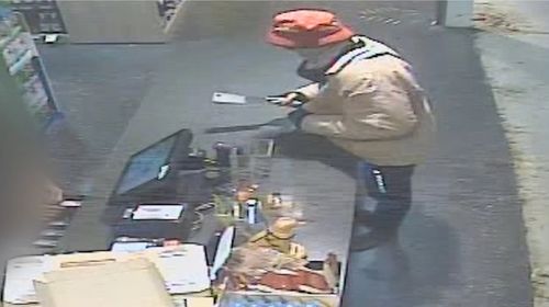 The man can be seen entering a store ï»¿on Dohles Rocks Road in Murrumba Downs armed with a meat cleaver at 7.30pm on June 7. 