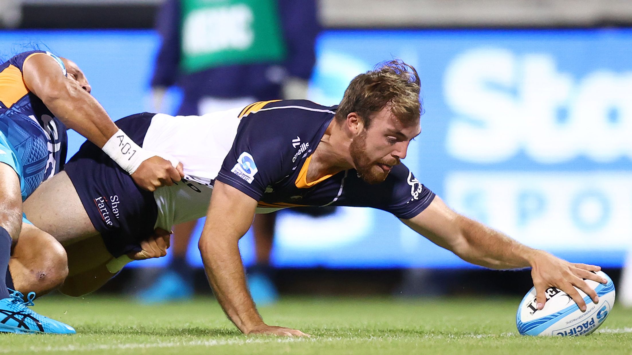 Hudson Creighton of the Brumbies scores a tryduring the round five Super Rugby Pacific match between ACT Brumbies and Moana Pasifika.