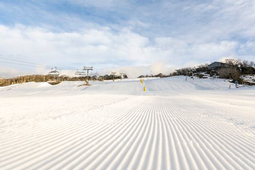 Groomed trails under the morning sun at Perisher, before the gates were opened.