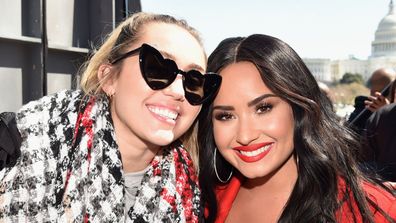 Miley Cyrus and Demi Lovato attend March For Our Lives on March 24, 2018 in Washington, DC. 