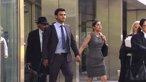 Deepak Dhankar leaves court with his wife and lawyers. (9NEWS)