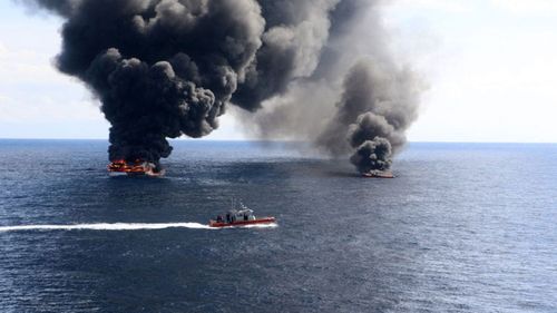 The US Coast Guard sets drug-smuggling vessels alight.