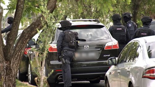 Anti-terrorism police during the raid on the western Sydney property. (Photo: AFP).