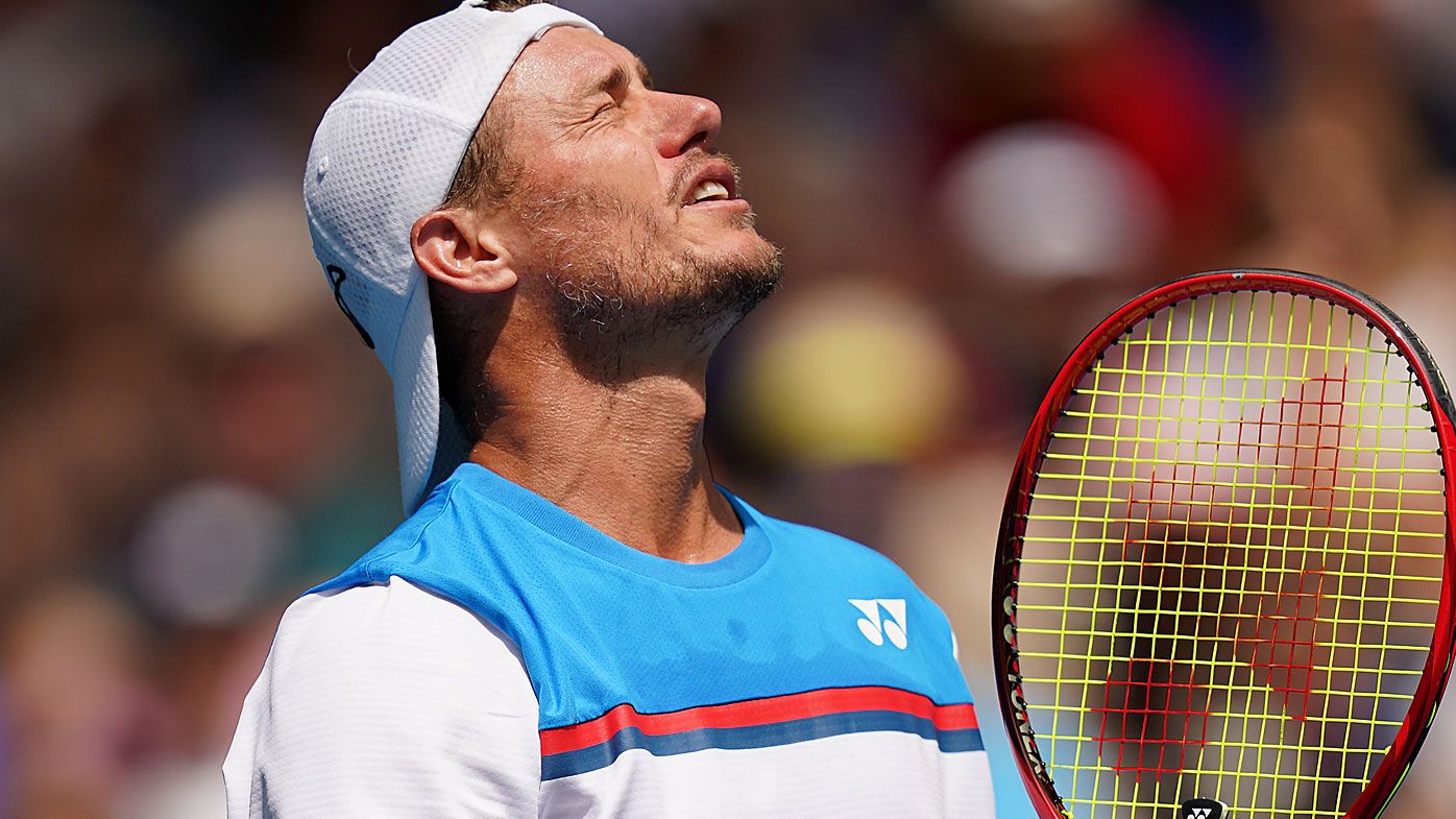 Lleyton Hewitt of Australia reacts during his first round doubles match with Jordan Thompson 