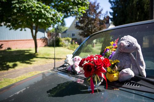 Flowers are placed on Karissa Fretwell's SUV outside her apartment in west Salem.