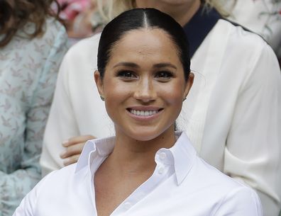 FILE - In this July 13, 2019 file photo Meghan, Duchess of Sussex smiles while sitting in the Royal Box on Centre Court to watch the women's singles final match between Serena Williams, of the United States, and Romania's Simona Halep on at the Wimbledon Tennis Championships in London. A British judge ruled Thursday Feb. 11, 2021, that a newspaper invaded Duchess of Sussex's privacy by publishing personal letter to her estranged father. (AP Photo/Ben Curtis, File)