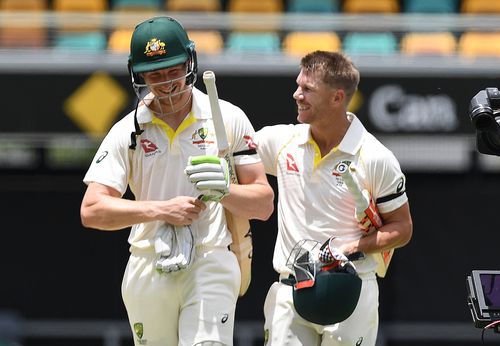 David Warner pats Bancroft on the back as they walk off after securing victory in the first Test at the Gabba. Picture: AAP