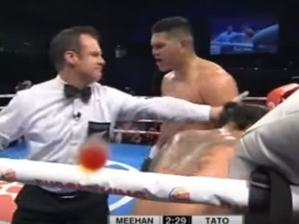 Willis Meehan pleads with the referee to stop his fight with Leamy Tato. (Supplied)