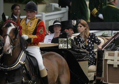 Britain's Princess Beatrice, at right, reacts as a horse leading her carriage becomes unsettled on the fifth day of the Royal Ascot horserace meeting, at Ascot Racecourse, in Ascot, England, Saturday, June 18, 2022. (AP Photo/Alastair Grant)