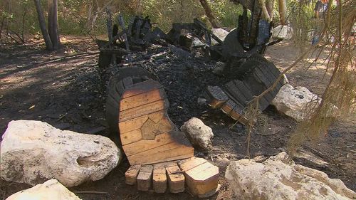 A $25,000 reward is on offer to help solve an arson attack on a new artwork in Perth, which police have branded "disgusting and cowardly".One of the giant wooden creations that made up part of new attraction The Giants of Mandurah was torched by arsonists at 11.30pm on Friday.