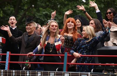 Erin O'Connor, Kate Moss, Charlotte Tilbury and Naomi Campbell ride a bus along the mall during the Platinum Pageant on June 05, 2022 in London, England.  