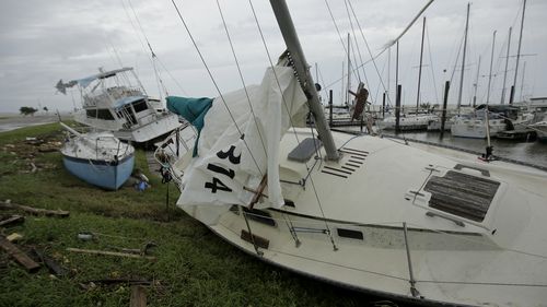 Boats damaged by Hurricane Harvey are submerged in water at a dock in Port Lavaca, Texas. (AAP)