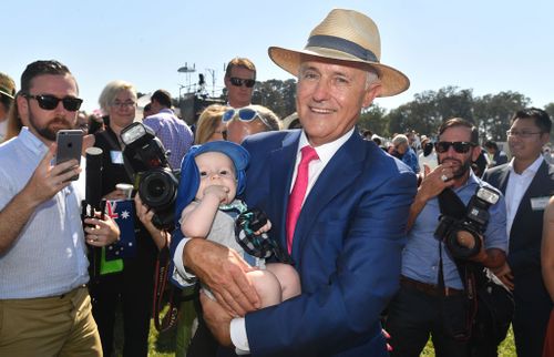The former Republican movement head holding a baby today. (AAP)