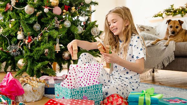 Girl opening Christmas present