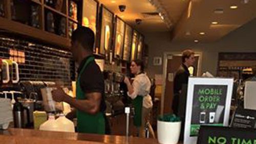 A Starbucks cashier is learning sign language to communicate with a customer in Leesburg , Virginia. (Ibby Piracha/ Facebook)