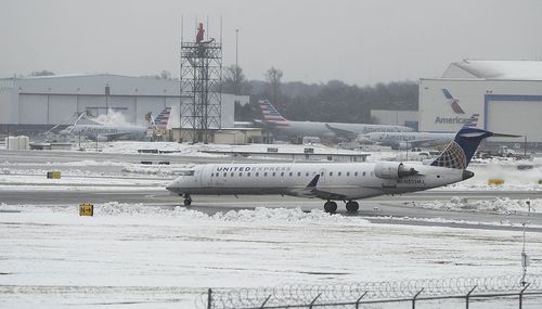 Flights were grounded, 300,000 were without power and schools and businesses were closed.