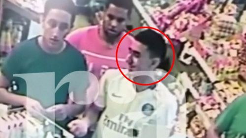 One of the men smiles at the counter of a petrol station hours before the deadly terror attack. (Image: Ara)