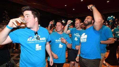 Liberal Party faithful cheer the early results at John Alexander's by-election night party. (AAP)