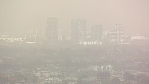 Aerial shots show reduced visibility as clouds of dust roll in across Sydney.