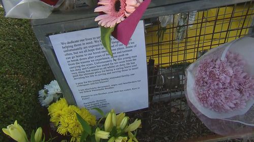 Flowers laid at Campbelltown McDonald's after a paramedic as allegedly stabbed to death by a 21-year-old man.